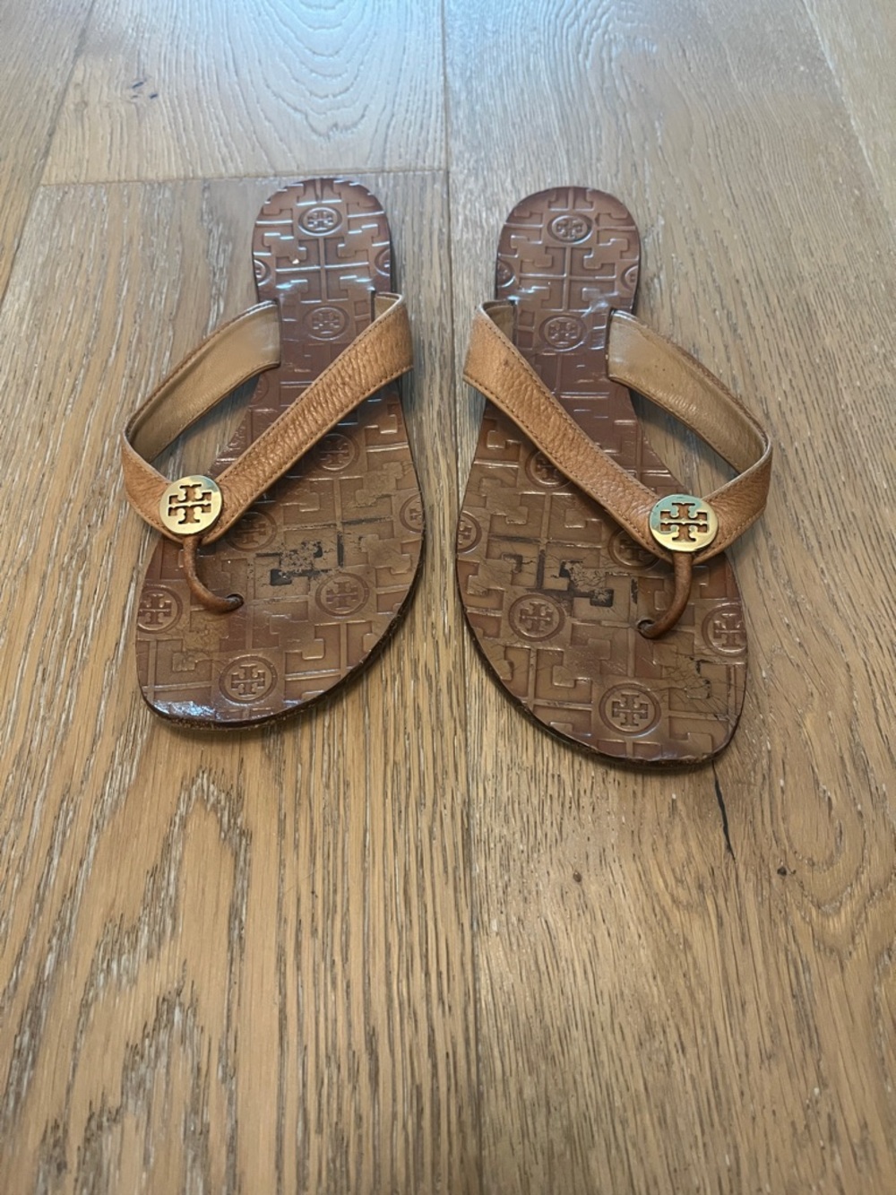 Tory Burch Tan/Bronze Leather Logo Flip Flops with Gold-Tone Medallions - Picture 2 of 5